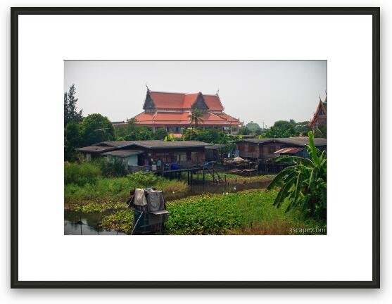 Homes over water, and temples Framed Fine Art Print