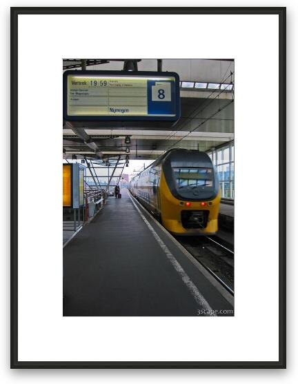 Intercity train pulling into Amsterdam Central station Framed Fine Art Print