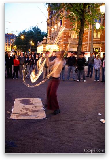Street performer showing off fire ropes Fine Art Print