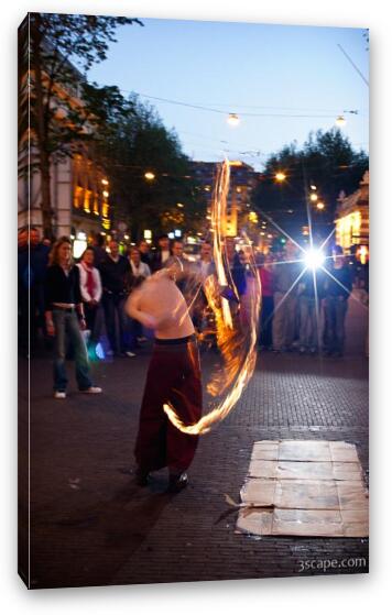 Street performer showing off fire ropes Fine Art Canvas Print