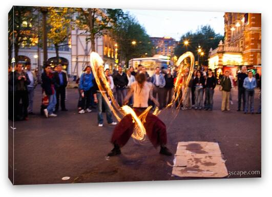 Street performer showing off fire ropes Fine Art Canvas Print
