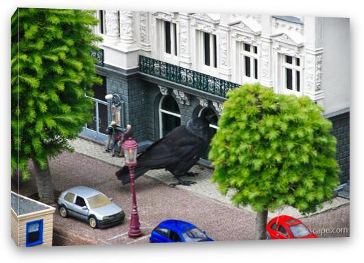 Giant crow attacking a store front Fine Art Canvas Print