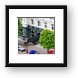 Giant crow attacking a store front Framed Print