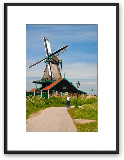 Bicycle riding and windmills Framed Fine Art Print