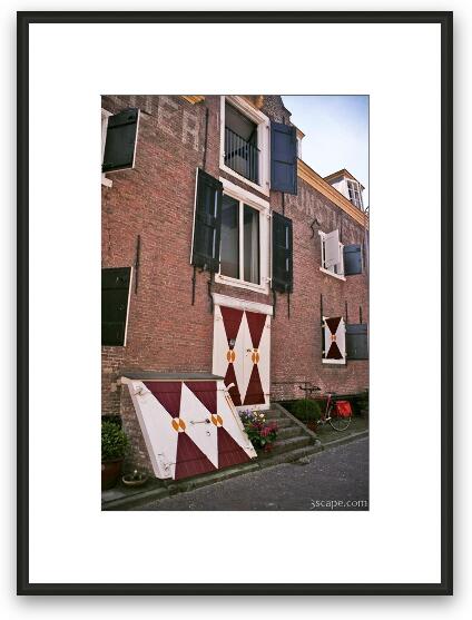 Colored shutters all over town Framed Fine Art Print