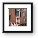 Colored shutters all over town Framed Print