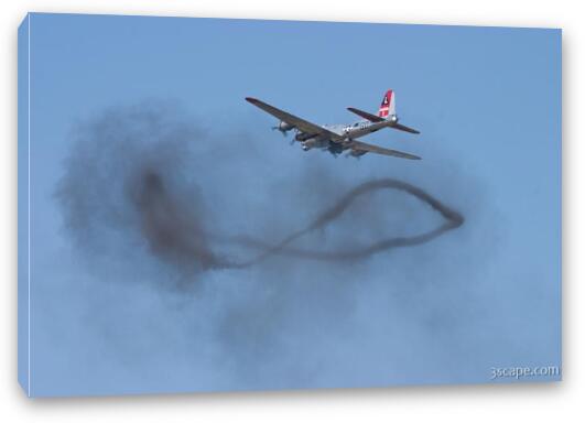 B-17 Flying Fortress over a smoke ring from bombing run Fine Art Canvas Print
