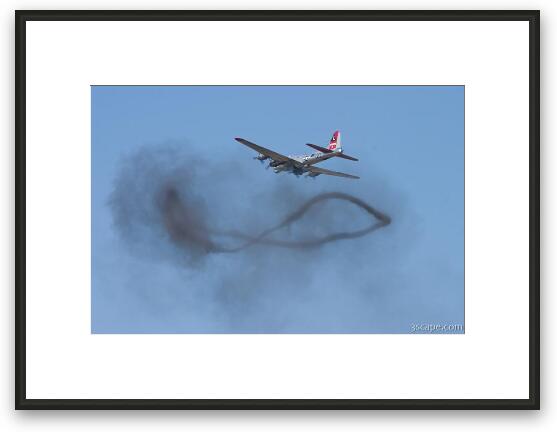 B-17 Flying Fortress over a smoke ring from bombing run Framed Fine Art Print