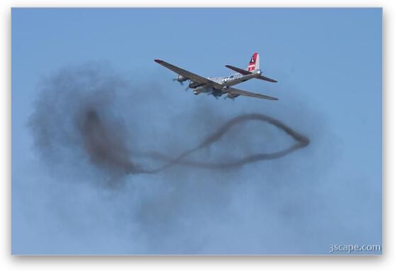 B-17 Flying Fortress over a smoke ring from bombing run Fine Art Metal Print