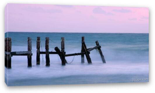 Morning waves at the destroyed dock Fine Art Canvas Print