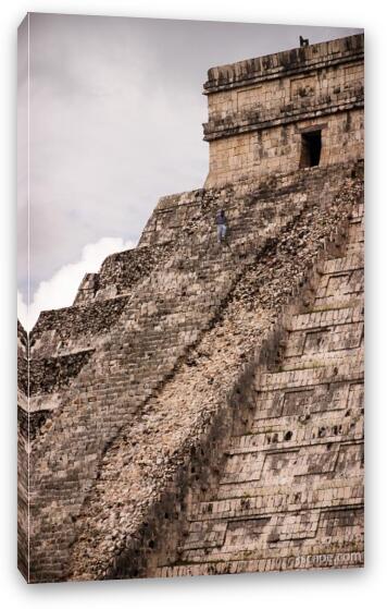 Worker climbing up the ruined side of El Castillo Fine Art Canvas Print