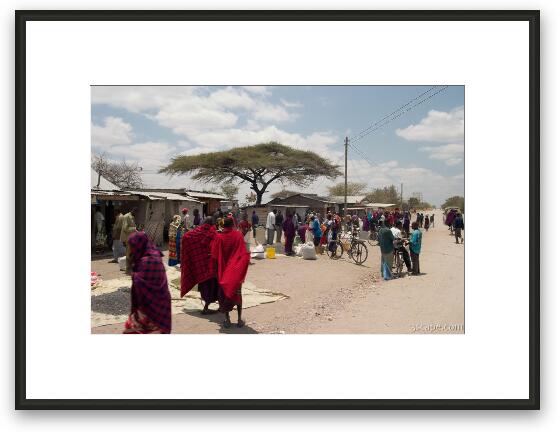 Maasai people and locals in a small town near Arusha Framed Fine Art Print