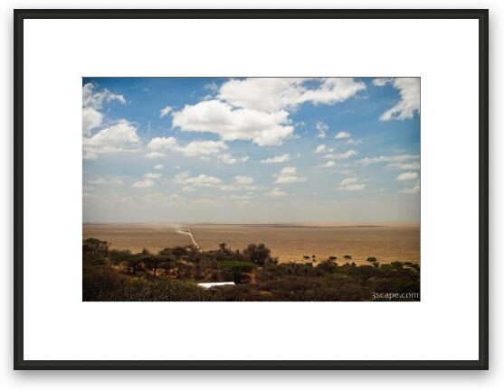 The long dusty road leading into Serengeti National Park Framed Fine Art Print