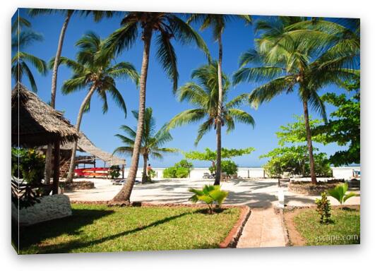 The beach and palm trees at the resort Fine Art Canvas Print