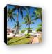 The beach and palm trees at the resort Canvas Print