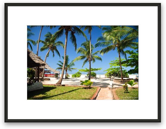 The beach and palm trees at the resort Framed Fine Art Print