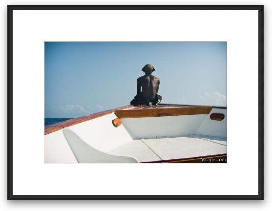 Dive master riding on the front of our bouncing boat Framed Fine Art Print