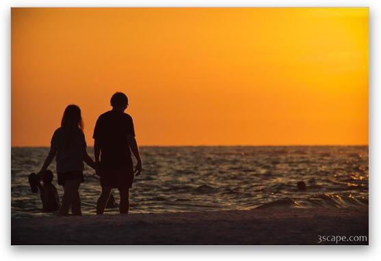 Couple taking a romantic walk on the beach Fine Art Metal Print