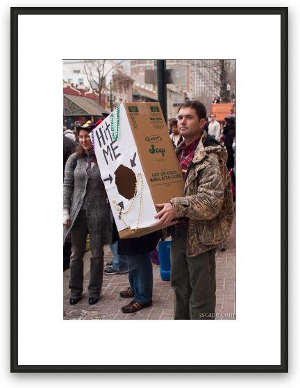 Guy holding a box for catching beads Framed Fine Art Print
