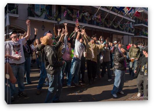 People on Bourbon Street trying to catch beads Fine Art Canvas Print