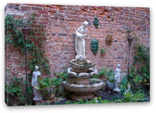 Fountain and sculptures tucked away in an alley Fine Art Canvas Print