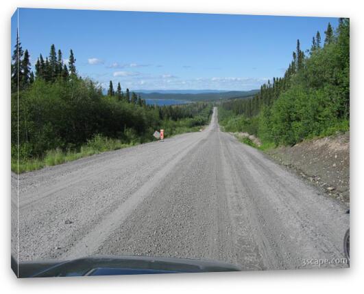 Endless gravel road with view of Manicouagan Reservoir Fine Art Canvas Print