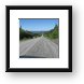 Endless gravel road with view of Manicouagan Reservoir Framed Print