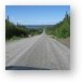 Endless gravel road with view of Manicouagan Reservoir Metal Print