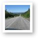 Endless gravel road with view of Manicouagan Reservoir Art Print