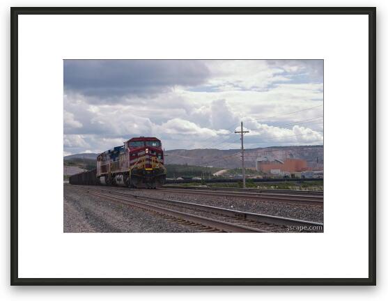 Very long train filled with iron ore Framed Fine Art Print