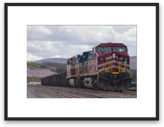 Very long train filled with iron ore Framed Fine Art Print