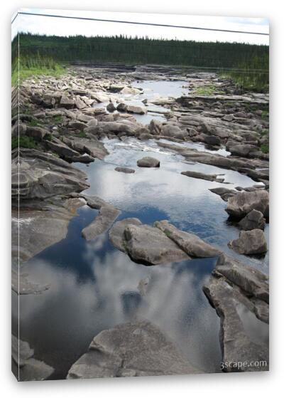 Reflections in still water and massive boulders Fine Art Canvas Print