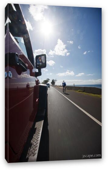 Bicycle rider on Maui highway Fine Art Canvas Print