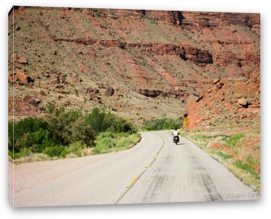 Motorcycle riding in canyon country Fine Art Canvas Print