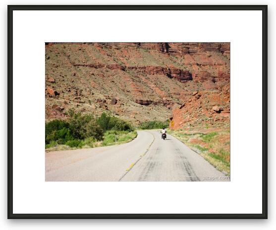 Motorcycle riding in canyon country Framed Fine Art Print