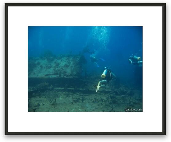 Divers around the wreck Framed Fine Art Print