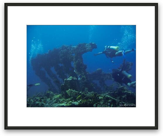 Divers around the wreck Framed Fine Art Print