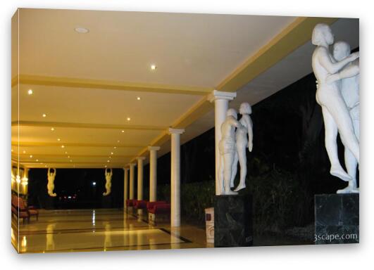 Hallway and statues at the resort Fine Art Canvas Print