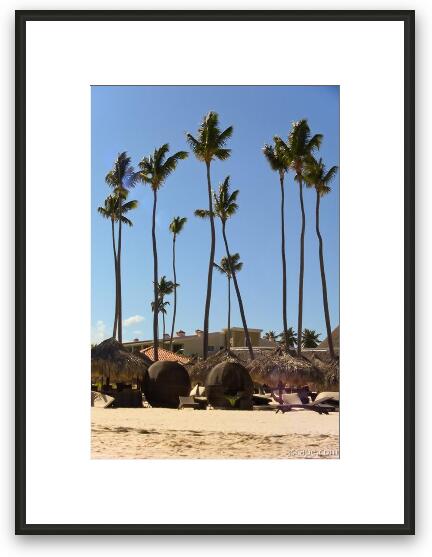 Wicker ball shaped loungers and palm trees at the beach Framed Fine Art Print