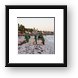 Resort workers cleaning seaweed off the beach Framed Print