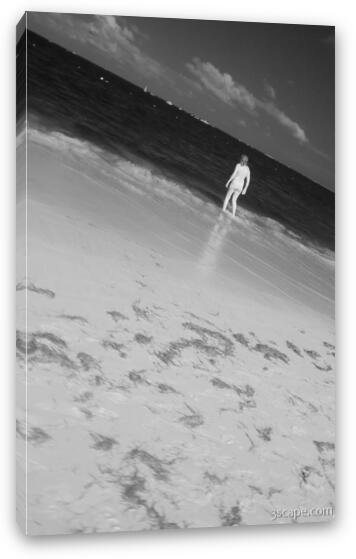 Woman wading in the water Fine Art Canvas Print