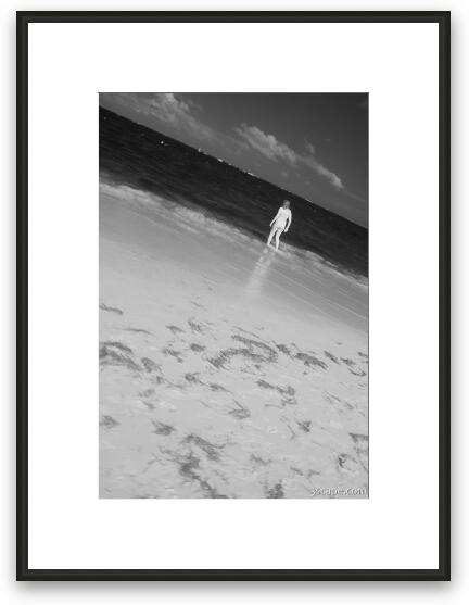 Woman wading in the water Framed Fine Art Print