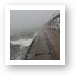 Pier in fog and waves Art Print