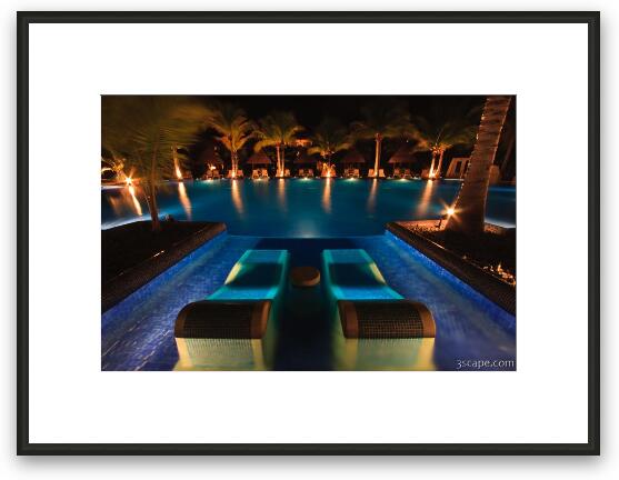 Night shot of the adult pool with sunken loungers Framed Fine Art Print