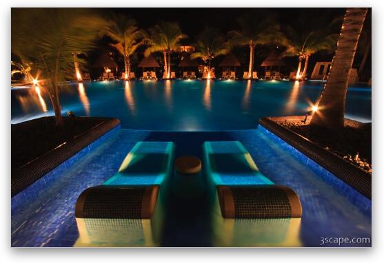 Night shot of the adult pool with sunken loungers Fine Art Print