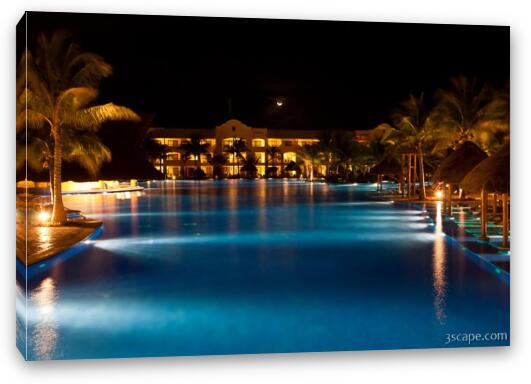 Night shot of the main pool area with moon visible Fine Art Canvas Print